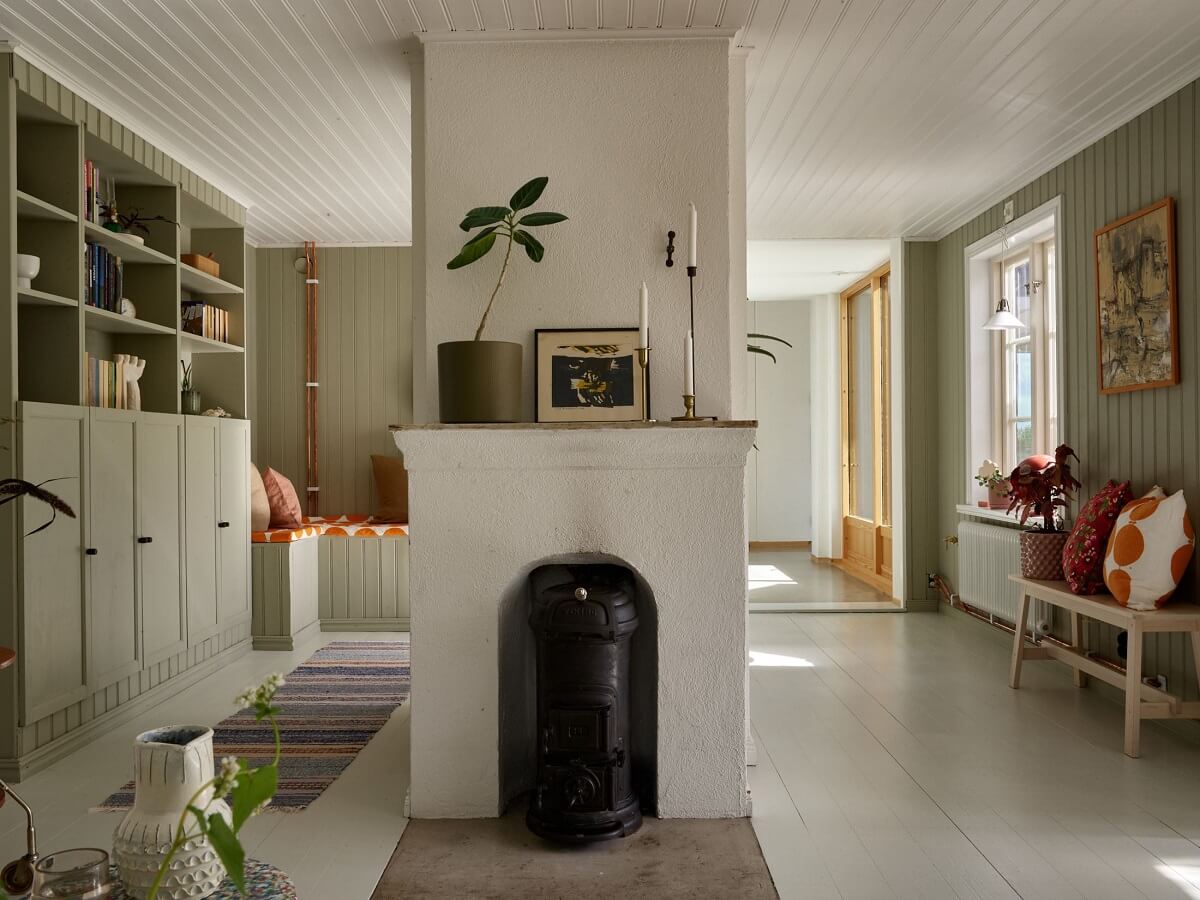 A Small Historic Swedish House with a Modern Extension 18 living-room-fireplace-green-walls-nordroom