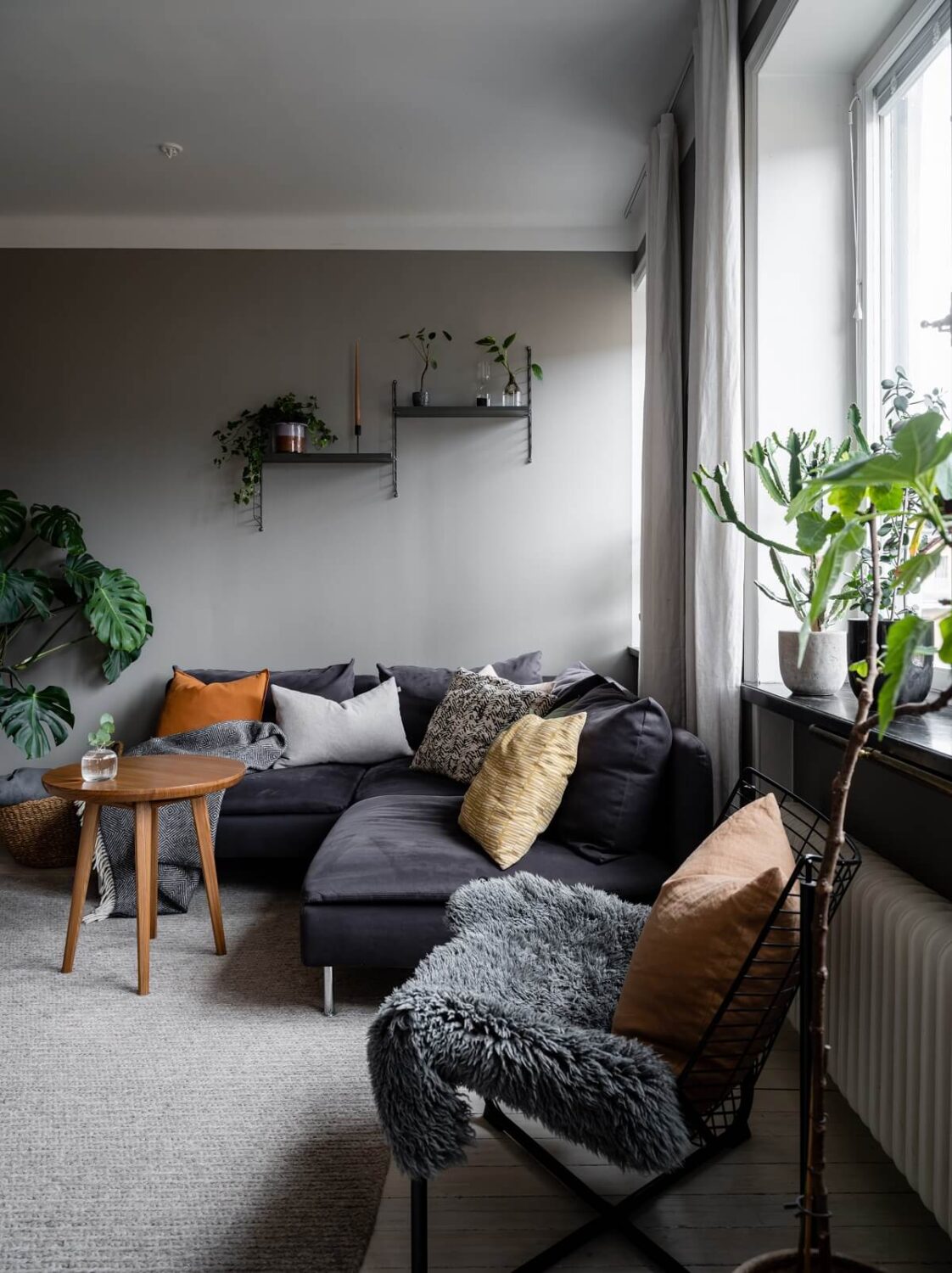 A Gray Nordic Apartment with a Terracotta Bedroom 5 living-room-gray-walls-scandinavian-design-nordroom