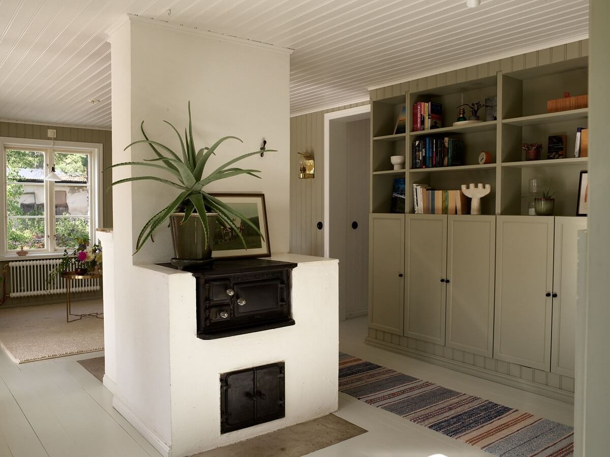 A Small Historic Swedish House with a Modern Extension 20 living-room-green-built-in-cabinets-nordroom