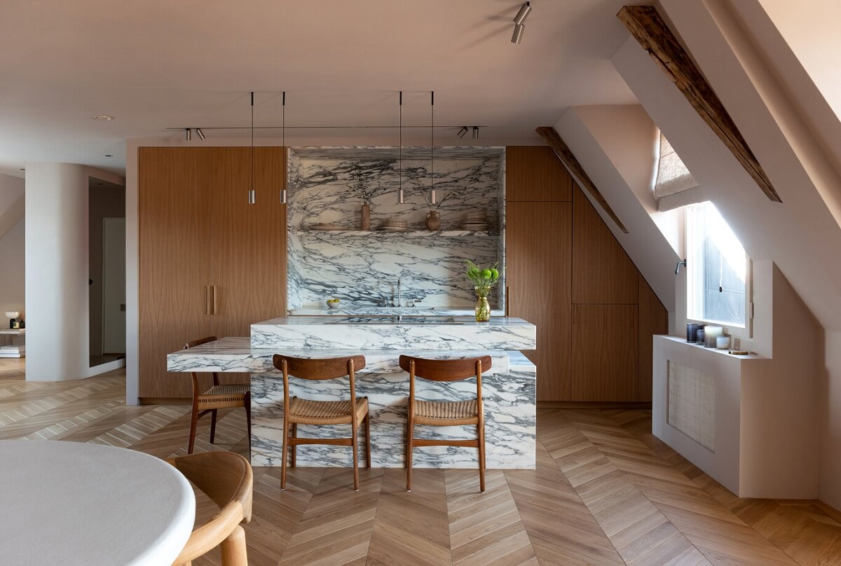 A Luxurious Penthouse Apartment in Stockholm 10 marble-kitchen-wooden-cabinets-slanted-ceiling-nordroom