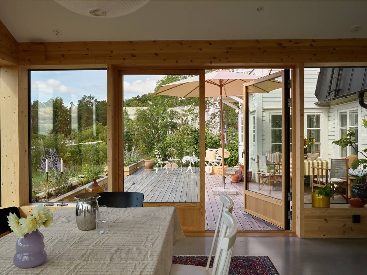 A Small Historic Swedish House with a Modern Extension 7 modern-wooden-extension-kitchen-dining-room