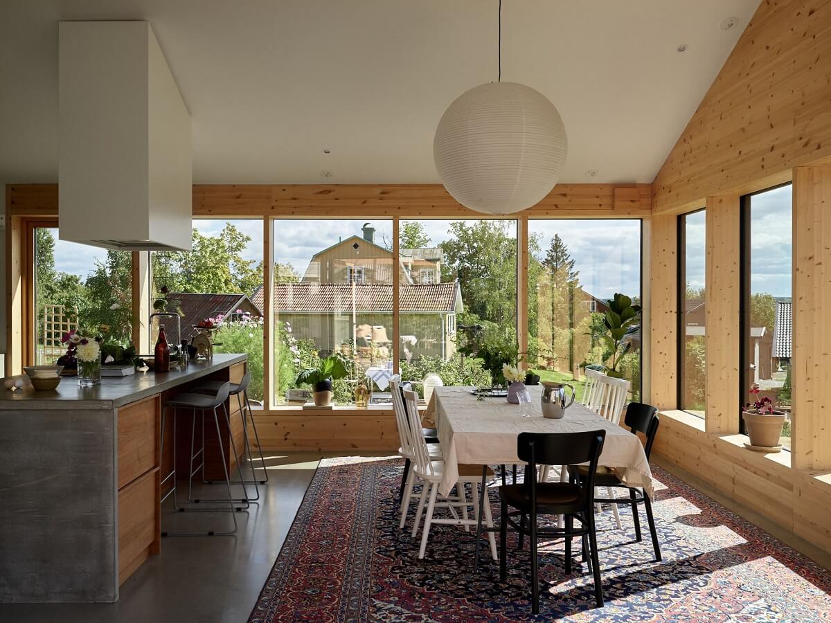 A Small Historic Swedish House with a Modern Extension 2 modern-wooden-kitchen-dining-room-pitched-ceiling-nordroom