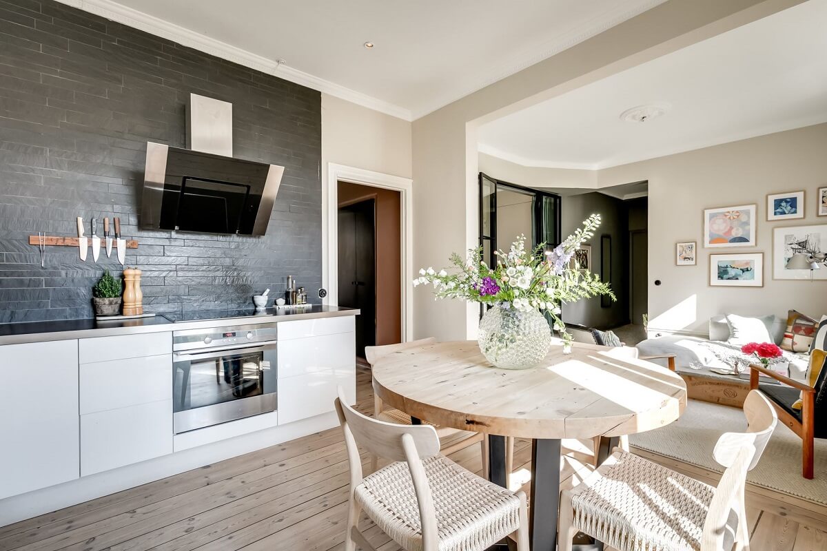 A Custom Headboard in a Light-Filled Swedish Apartment 12 open-plan-kitchen-living-room-nordroom