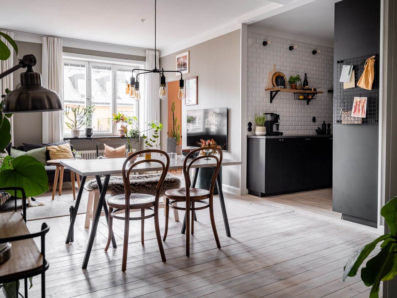 A Gray Nordic Apartment with a Terracotta Bedroom 7 open-plan-living-room-black-kitchen-nordroom