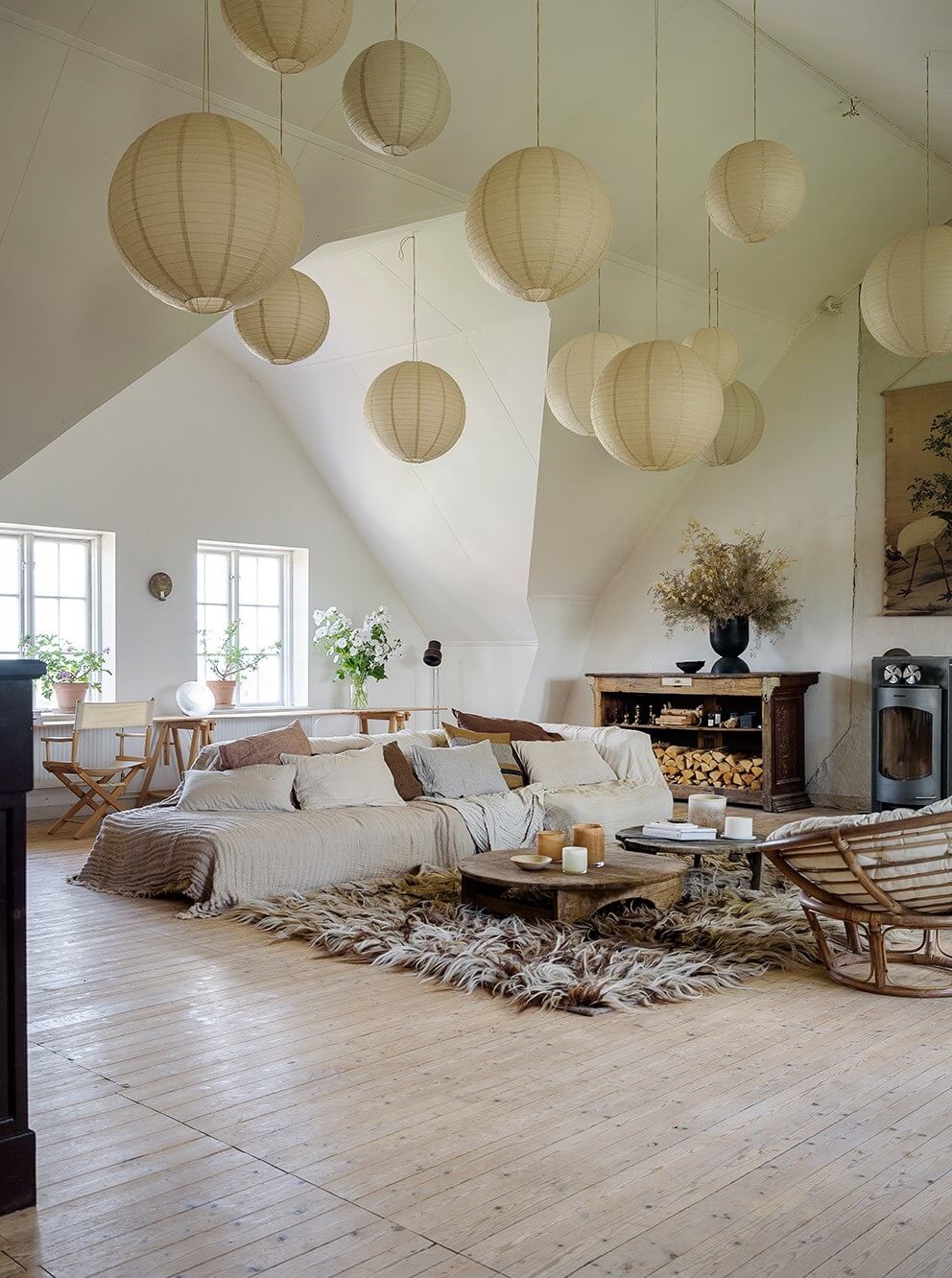 open-plan-living-room-slanted-celing-pendant-lights-nordroom