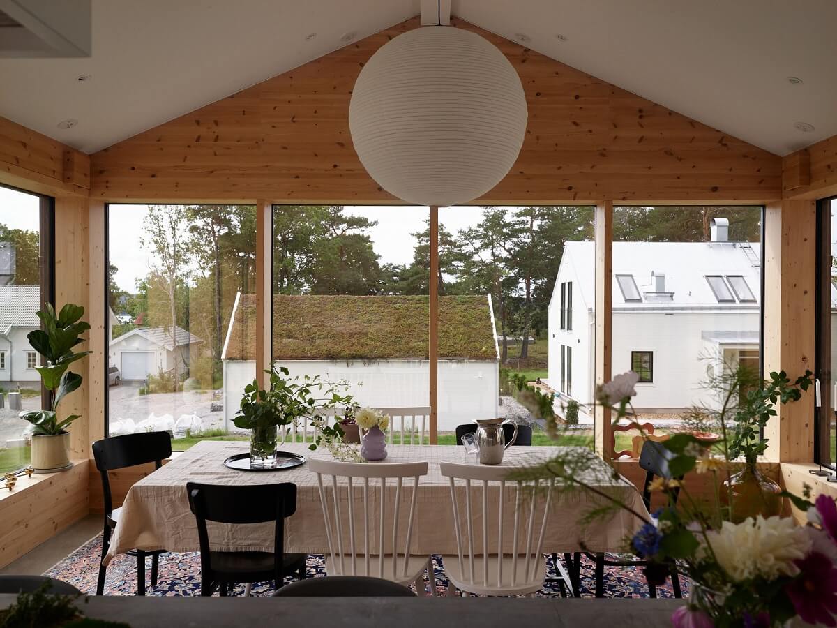 A Small Historic Swedish House with a Modern Extension 8 pitched-ceiling-modern-wooden-dining-room-kitchen-nordroom
