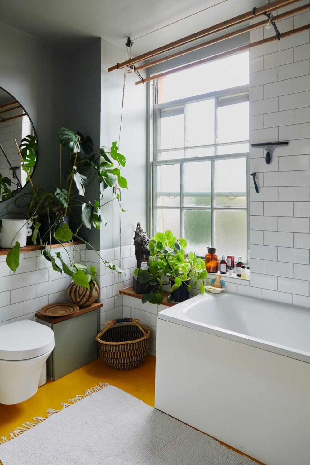 A London Apartment with a Small Blue deVOL Kitchen 13 plant-filled-bathroom-yellow-floor-light-gray-walls-nordroom