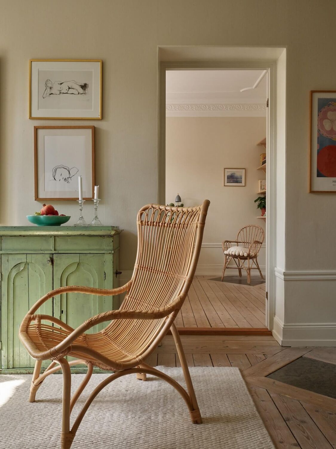 Beige Walls in a Serene Family Apartment in Sweden 3 rattan-lounge-chair-light-green-cabinet-nordroom