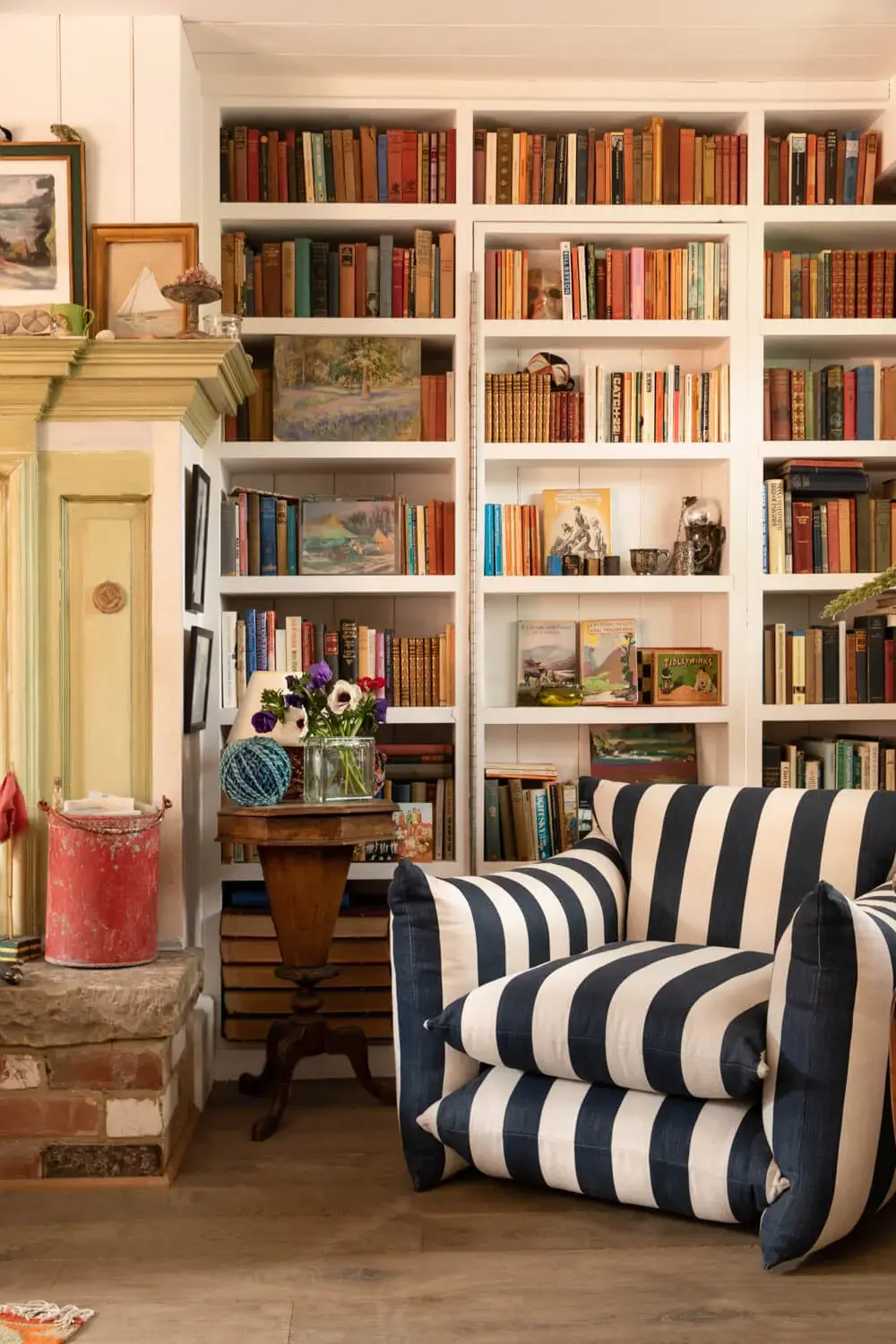 Interior Design Trends for 2024: Comfort, Nature, and Warmth 12 reading-nook-bookcases-striped-armchair-buchanan-studio-nordroom