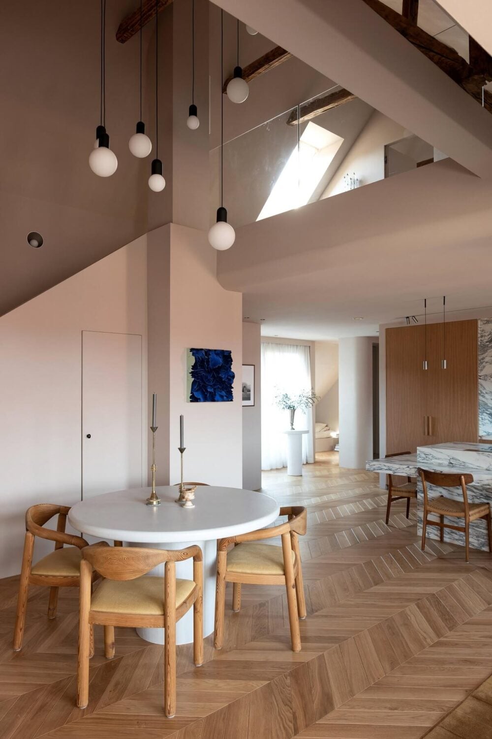 Herringbone vs. Chevron Flooring Patterns: Differences & Inspiration 36 round-dining-table-scandinavian-penthouse-nordroom