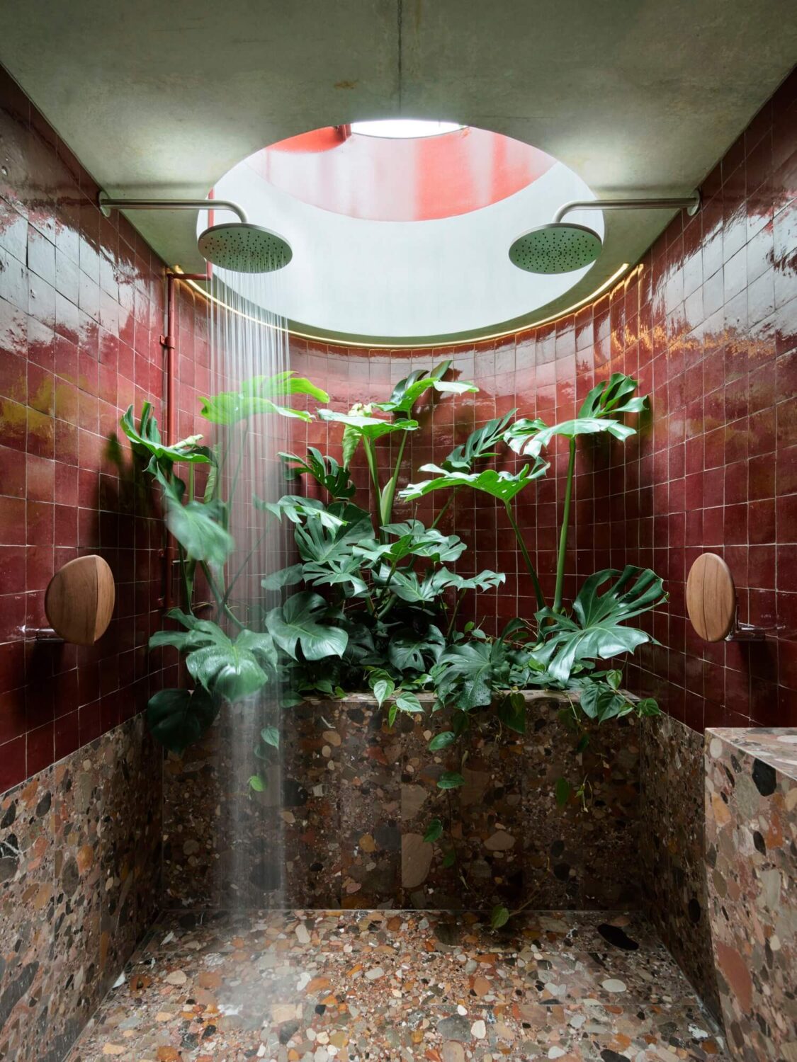 Best of 2023: Bathrooms 4 round-shower-with-plants-deep-red-tiles-nordroom