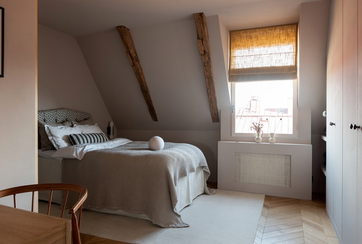 A Luxurious Penthouse Apartment in Stockholm 17 serene-bedroom-slanted-ceiling-wooden-beams-nordroom