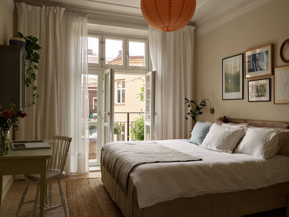 Beige Walls in a Serene Family Apartment in Sweden 13 serene-beige-bedroom-desk-balcony-nordroom