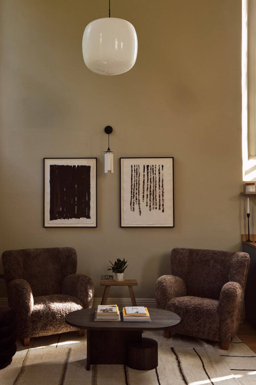 A Beautiful Chapel Conversion in England 8 sitting-area-two-armchairs-striped-rug-nordroom