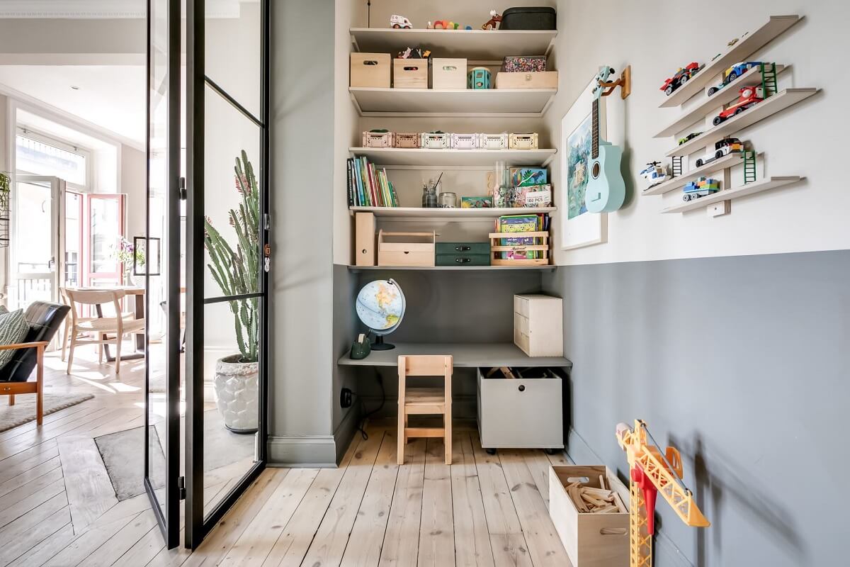 A Custom Headboard in a Light-Filled Swedish Apartment 9 small-childrens-room-half-painted-wall-desk-shelves-nordroom