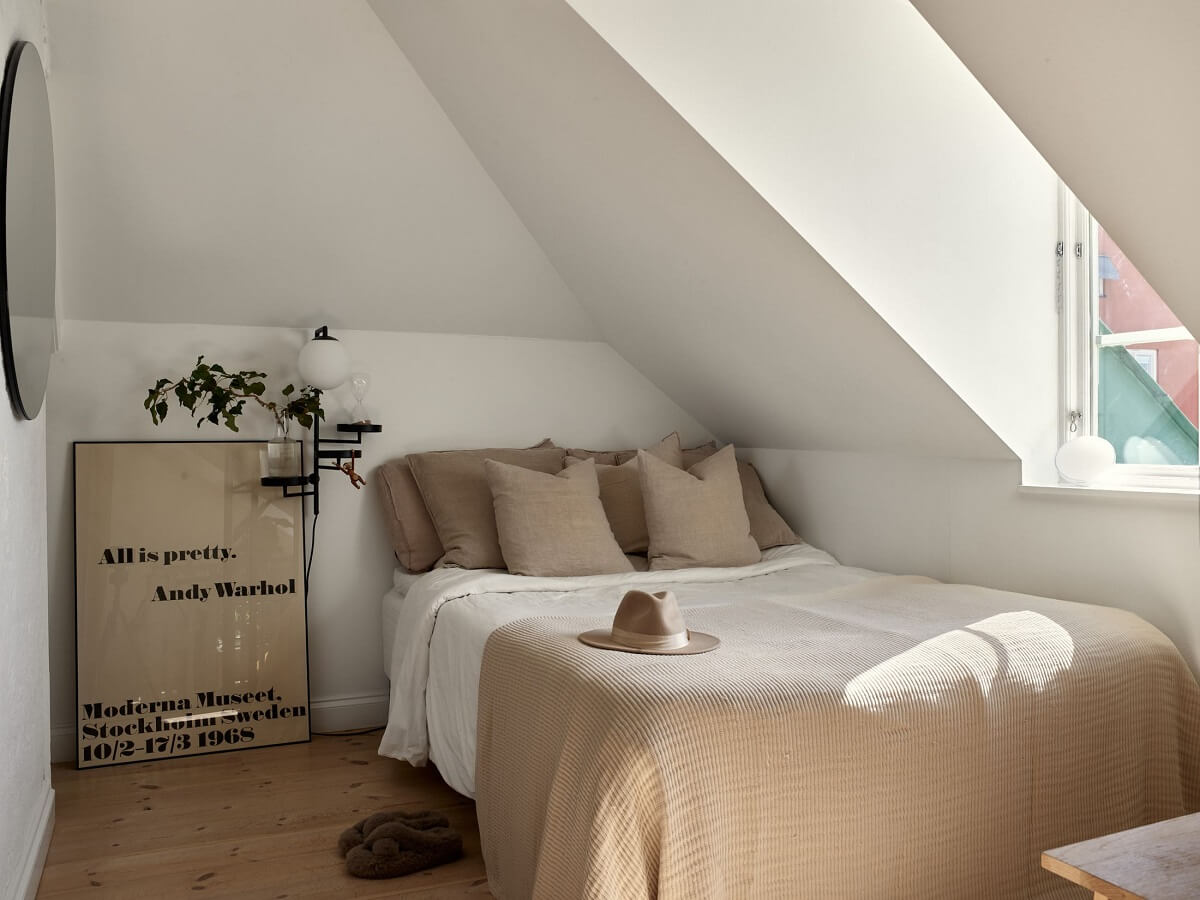 A Small Attic Apartment with Industrial Glass walls 14 small-white-bedroom-slanted-ceilings-nordroom