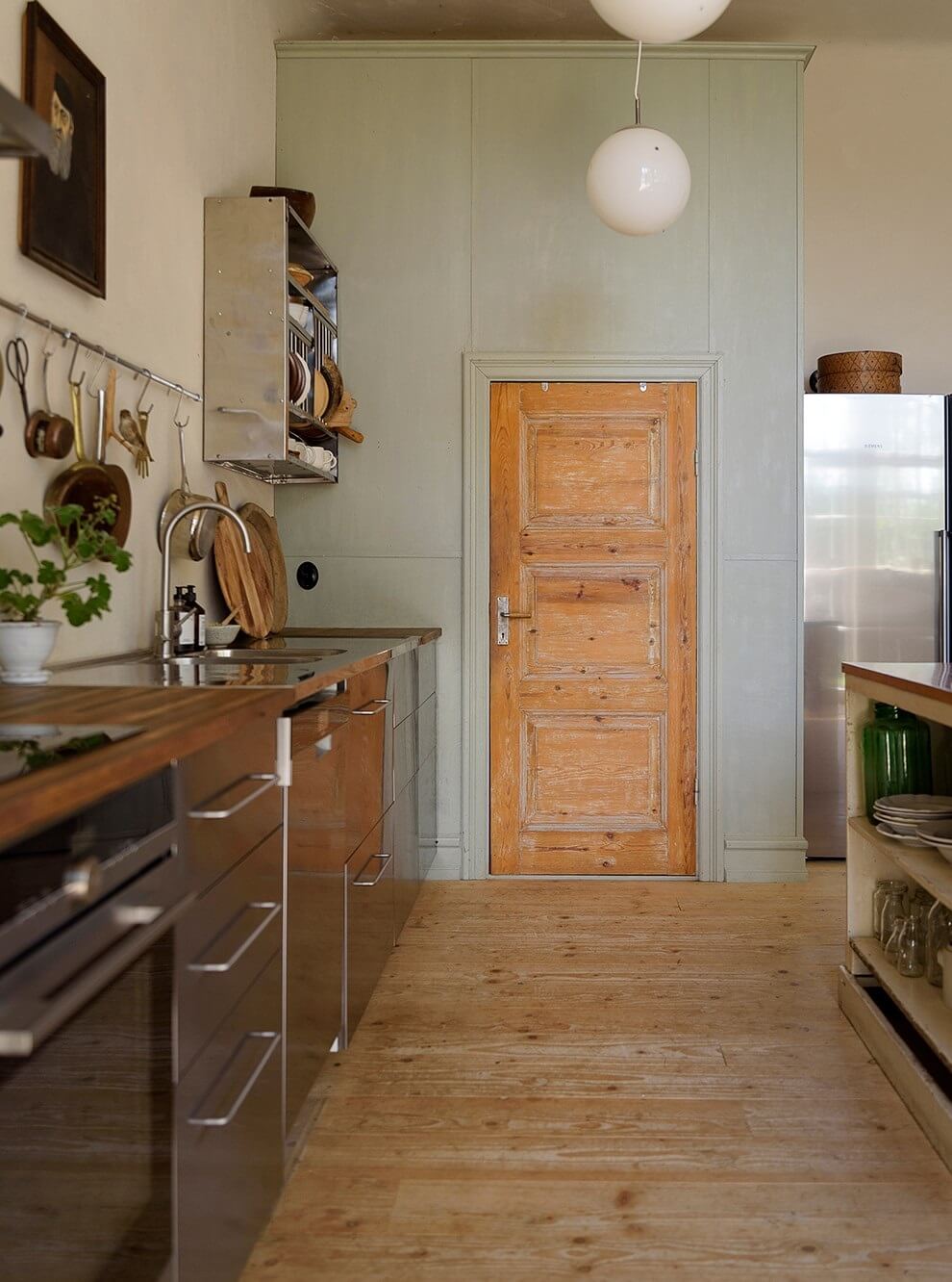 Natural Colors in a Swedish School Conversion 15 stainless-steel-kitchen-wooden-floor-nordroom