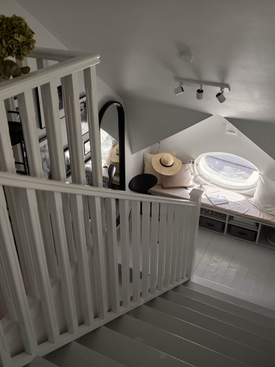 A Small Attic Apartment with Industrial Glass walls 18 staircase-bench-window-seat-nordroom