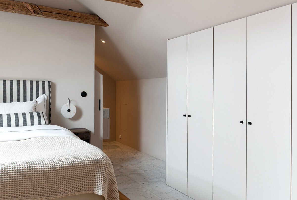 A Luxurious Penthouse Apartment in Stockholm 26 striped-headboard-master-bedroom-built-in-wardrobes-nordroom