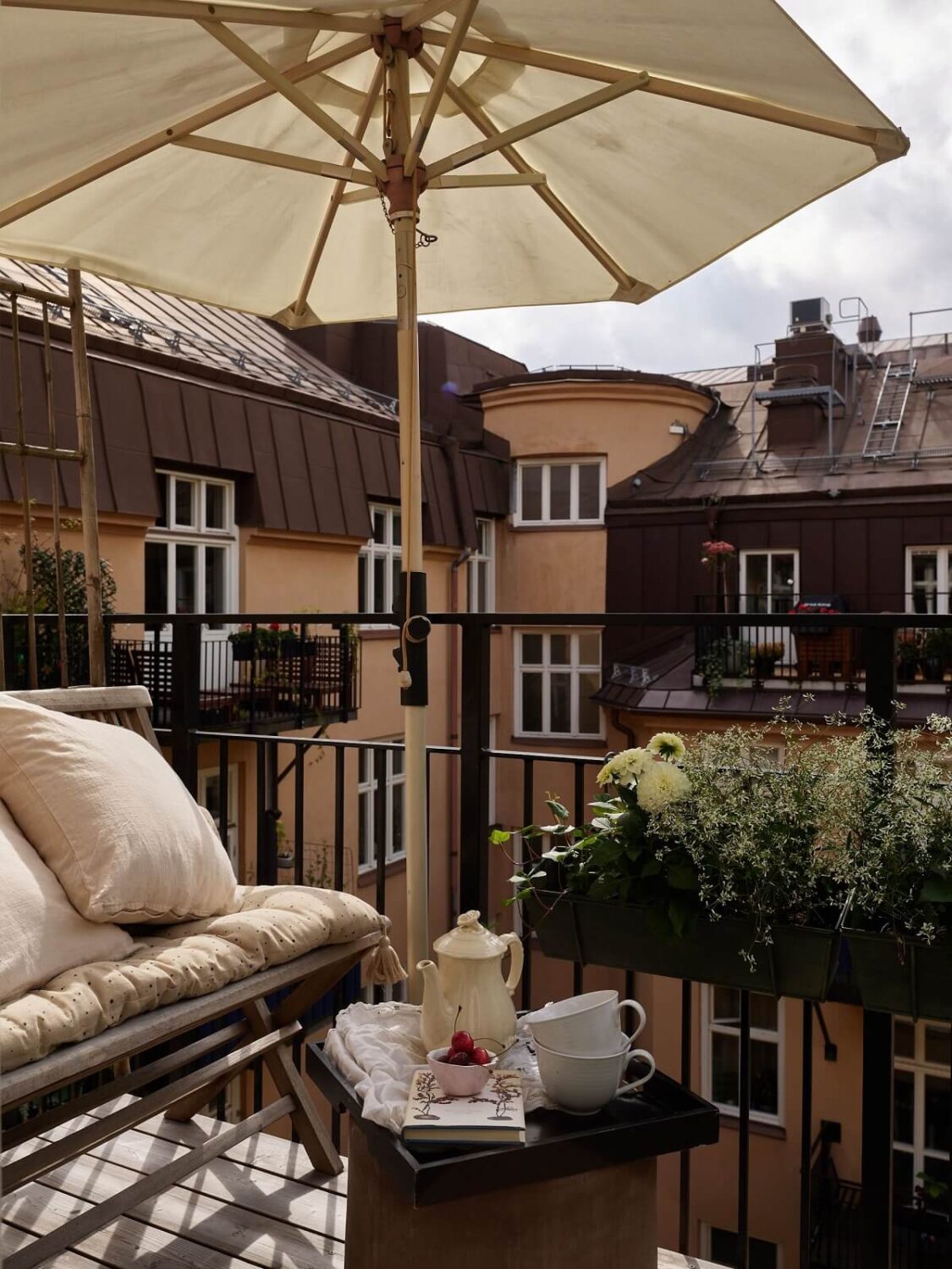 Beige Walls in a Serene Family Apartment in Sweden 20 sunny-balcony-overlooking-courtyard-nordroom