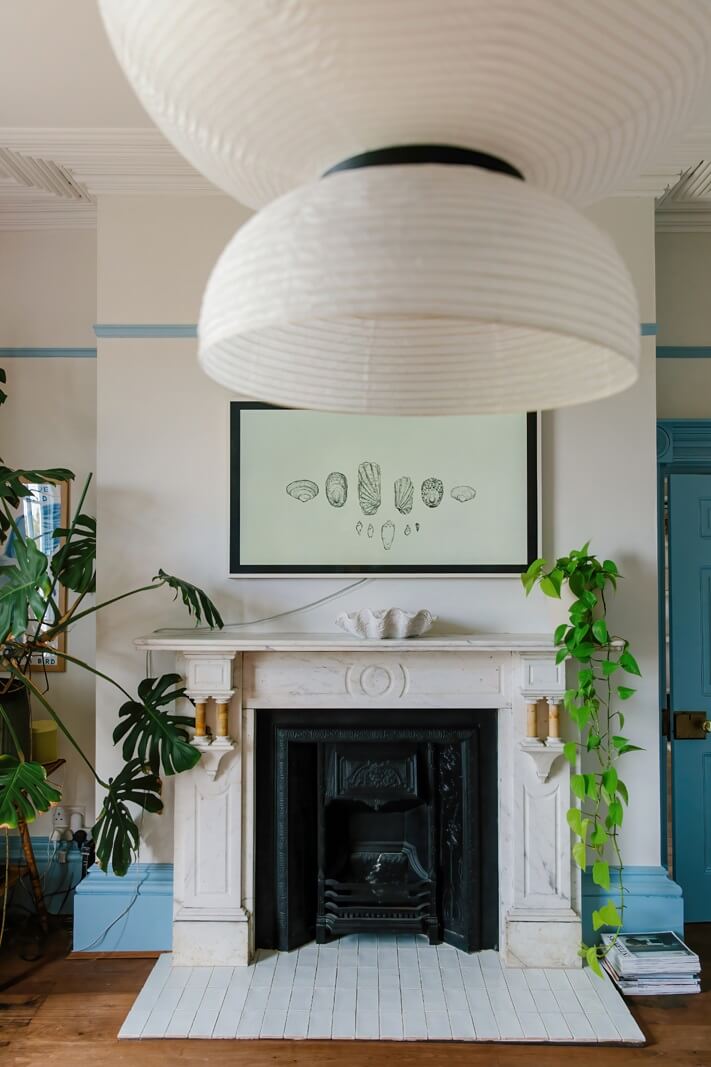 A Georgian House in England with Bold Color Pops 3 white-fireplace-light-blue-accents-nordroom