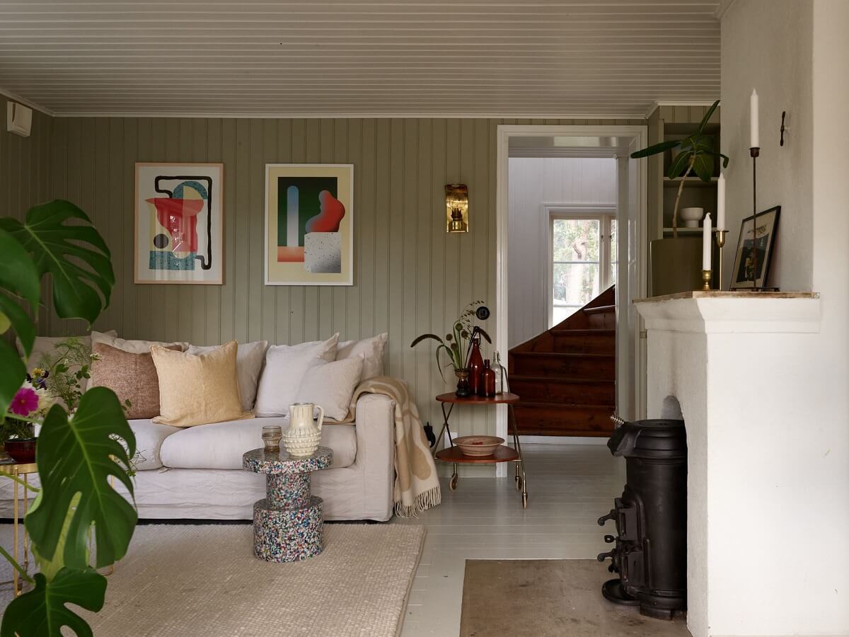 A Small Historic Swedish House with a Modern Extension 13 white-green-living-room-wooden-walls-nordroom