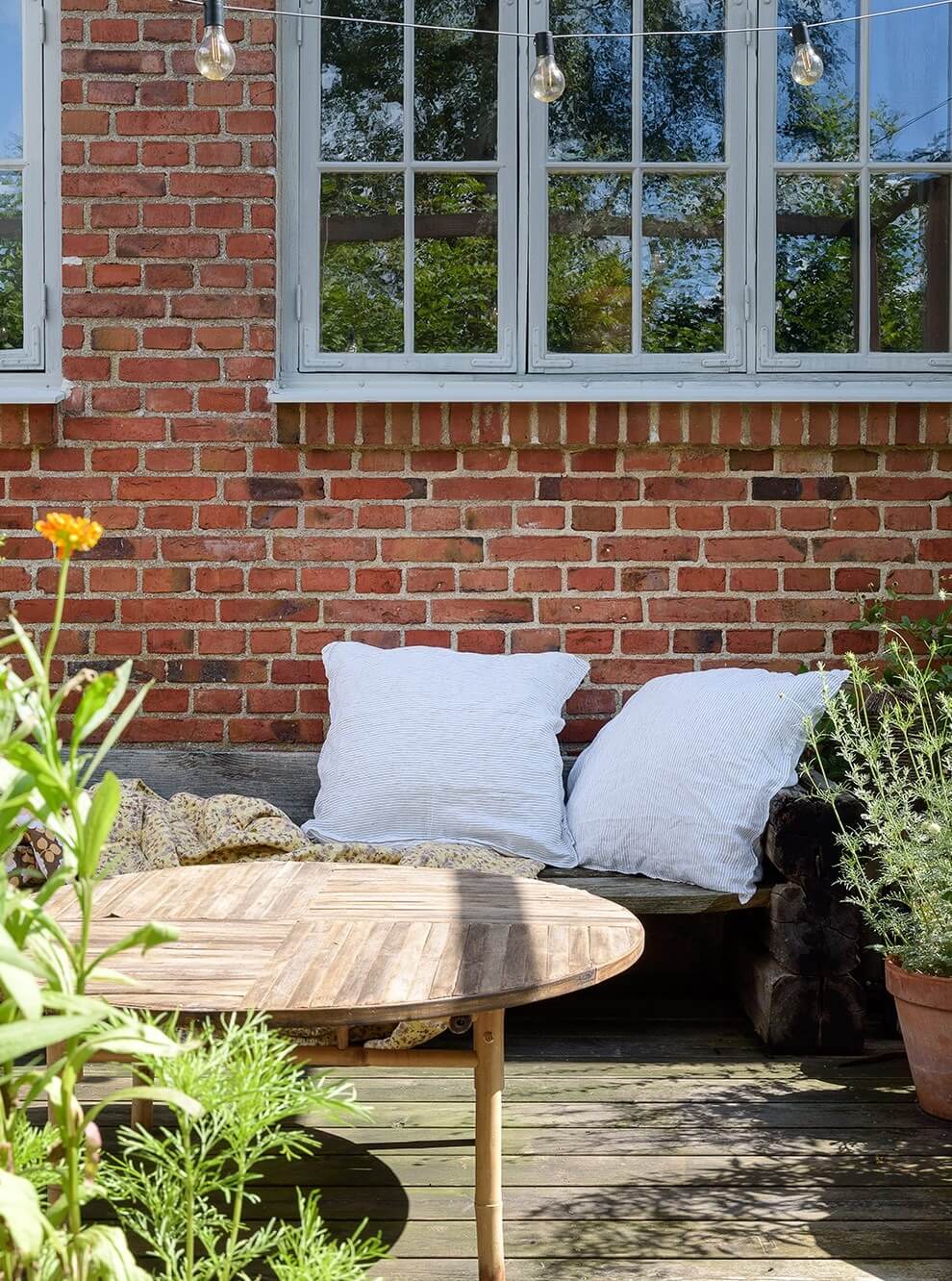 Natural Colors in a Swedish School Conversion 29 wooden-garden-terrace-lounge-seating-nordroom