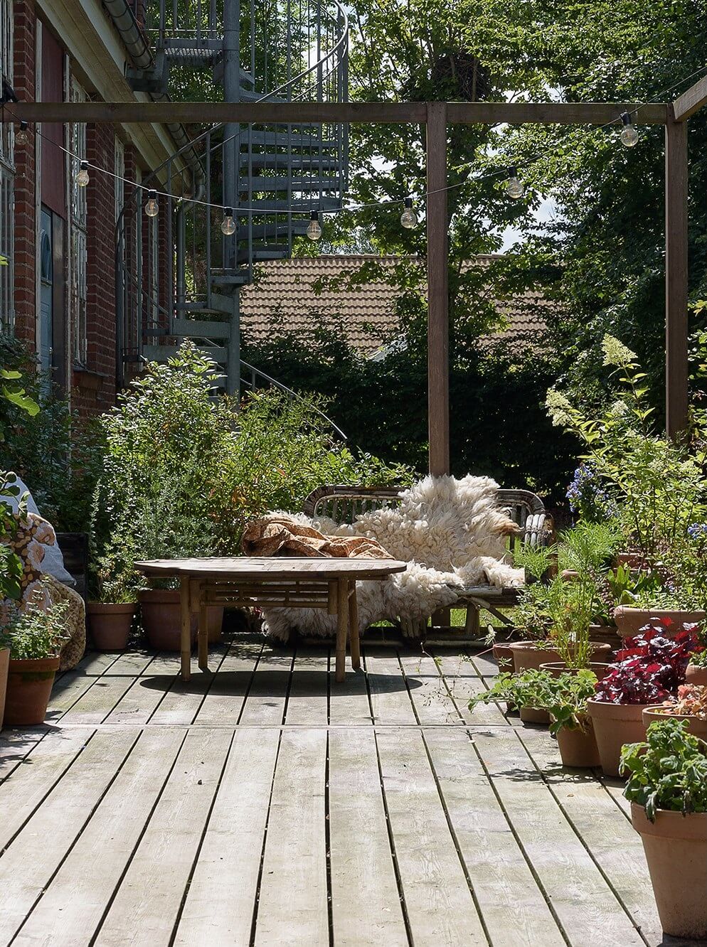 Natural Colors in a Swedish School Conversion 28 wooden-garden-terrace-plants-nordroom