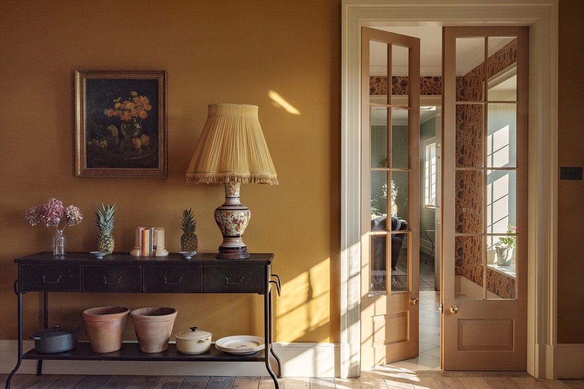 A Colorful Renovated Country House by Clarence & Graves 10 yellow-kitchen-walls-double-wood-glass-doors-nordroom