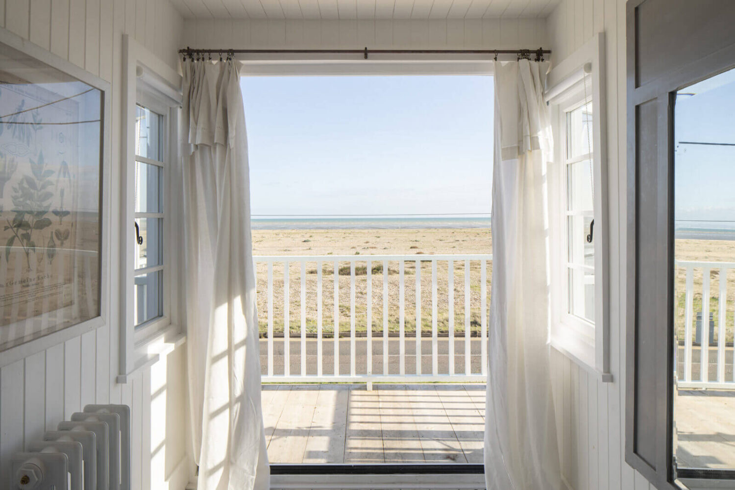A Bright Coastal Home with Blue Color Accents in England 16 balcony-sea-view