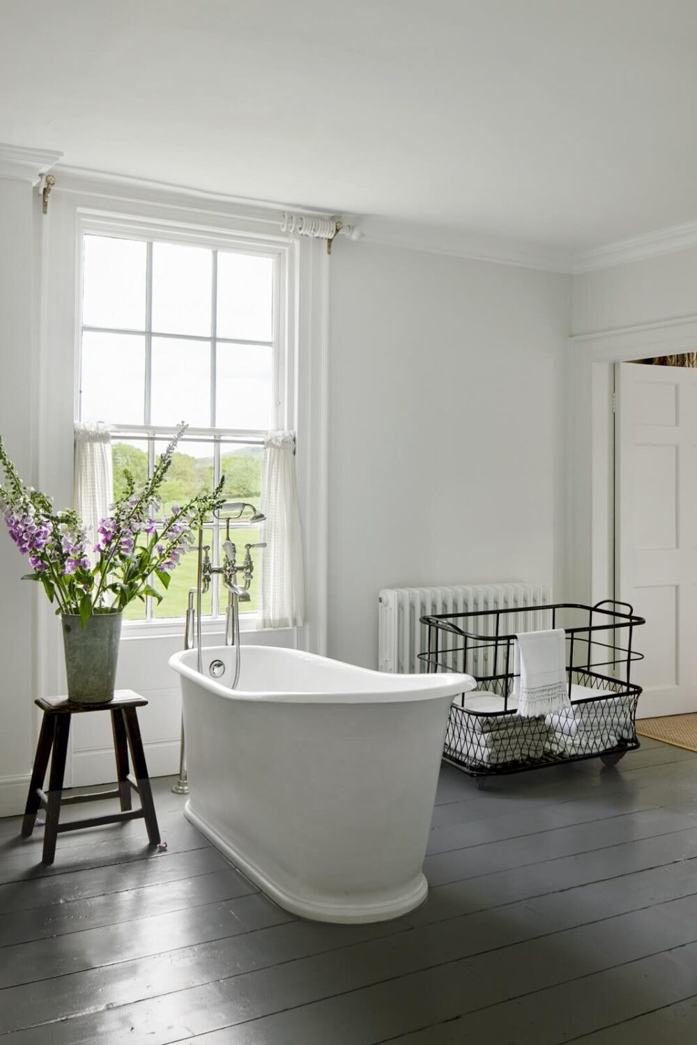 A Restored Georgian House with a Walled Garden 19 bathroom-wooden-floor-freestanding-bath-in-front-of-window-nordroom