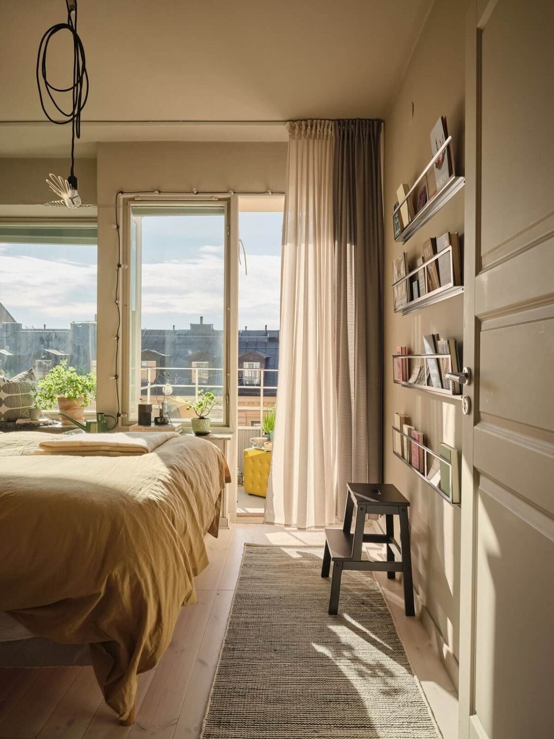 A Serene Beige Apartment with Two Balconies 12 bedroom-beige-walls-book-racks-nordroom
