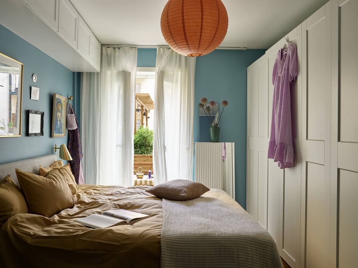 A Scandinavian Apartment with a Fresh Blue Bedroom 14 bedroom-blue-walls-wardrobes-nordroom