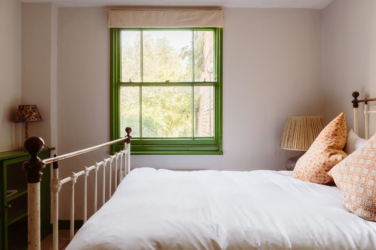 A Cozy Victorian House with Warm Color Accents 17 bedroom-green-window-frames-nordroom