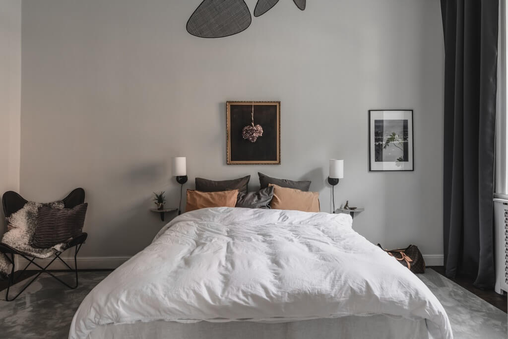 A Dark Gray Painted Ceiling in a Scandi Apartment 12 bedroom-light-gray-walls-dark-curtains-nordroom