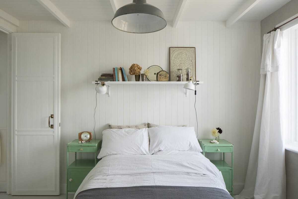 A Bright Coastal Home with Blue Color Accents in England 9 bedroom-mint-green-nightstands