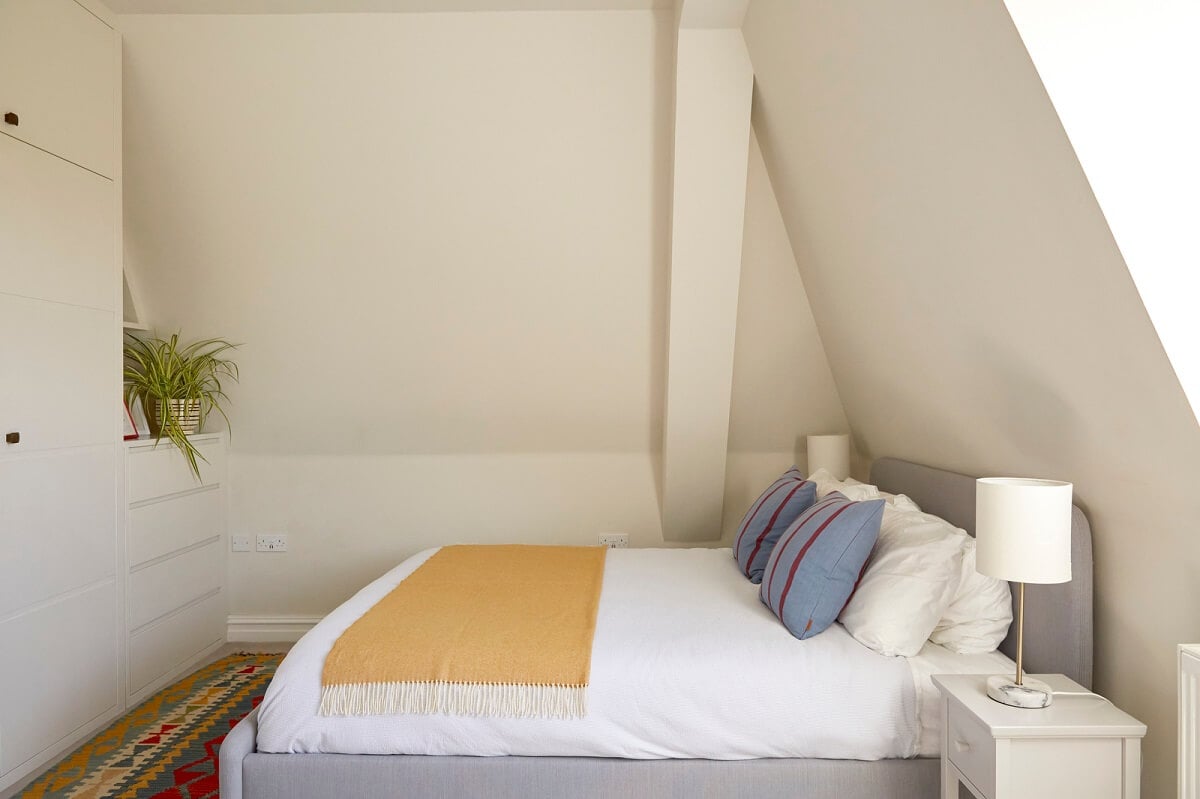 A Light Attic Apartment in London 11 bedroom-slanted-ceiling-built-in-wardrobes-nordroom