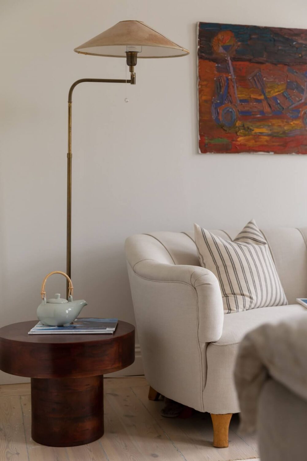 A Light Swedish Apartment with an Industrial Glass Wall 23 bedroom-sofa-lamp-detail-nordroom
