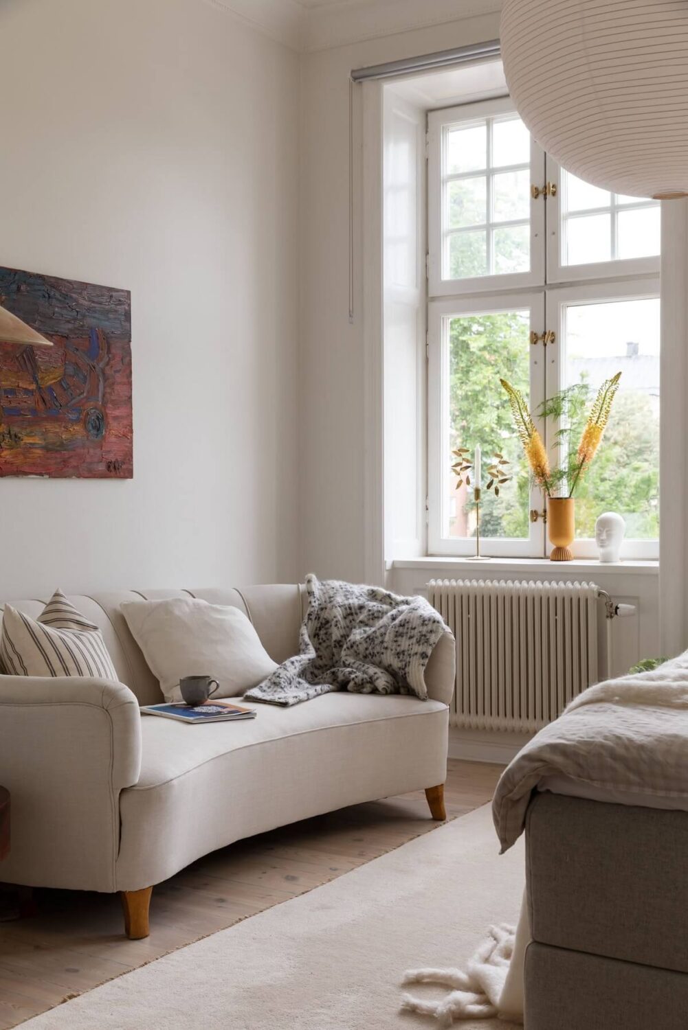 A Light Swedish Apartment with an Industrial Glass Wall 22 bedroom-sofa-light-colors-nordroom