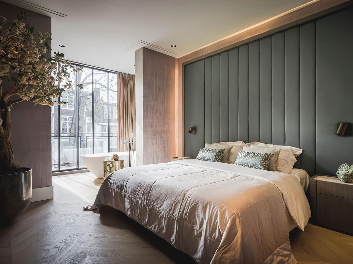 Interior Design Trends for 2024: Comfort, Nature, and Warmth 38 bedroom-soft-accent-wall-freestanding-bath-nordroom