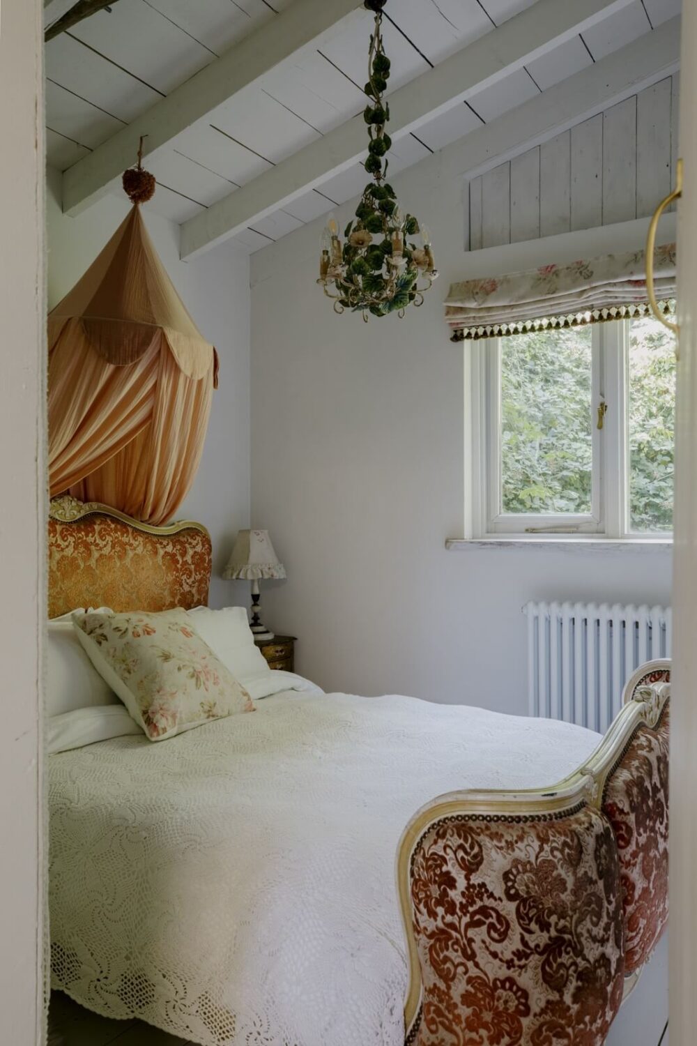 Pearl Lowe's Vintage Boho English Beach House is For Sale 22 bedroom-vaulted-ceiling-floral-bedframe-nordroom