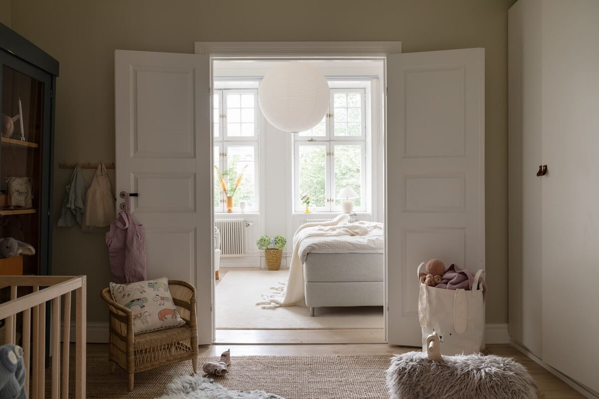 A Light Swedish Apartment with an Industrial Glass Wall 17 childrens-room-double-doors-to-master-bedroom