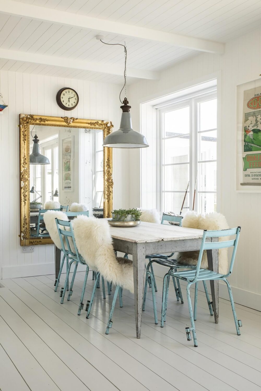 A Bright Coastal Home with Blue Color Accents in England 7 coastal-dining-space-light-blue-chairs-nordroom