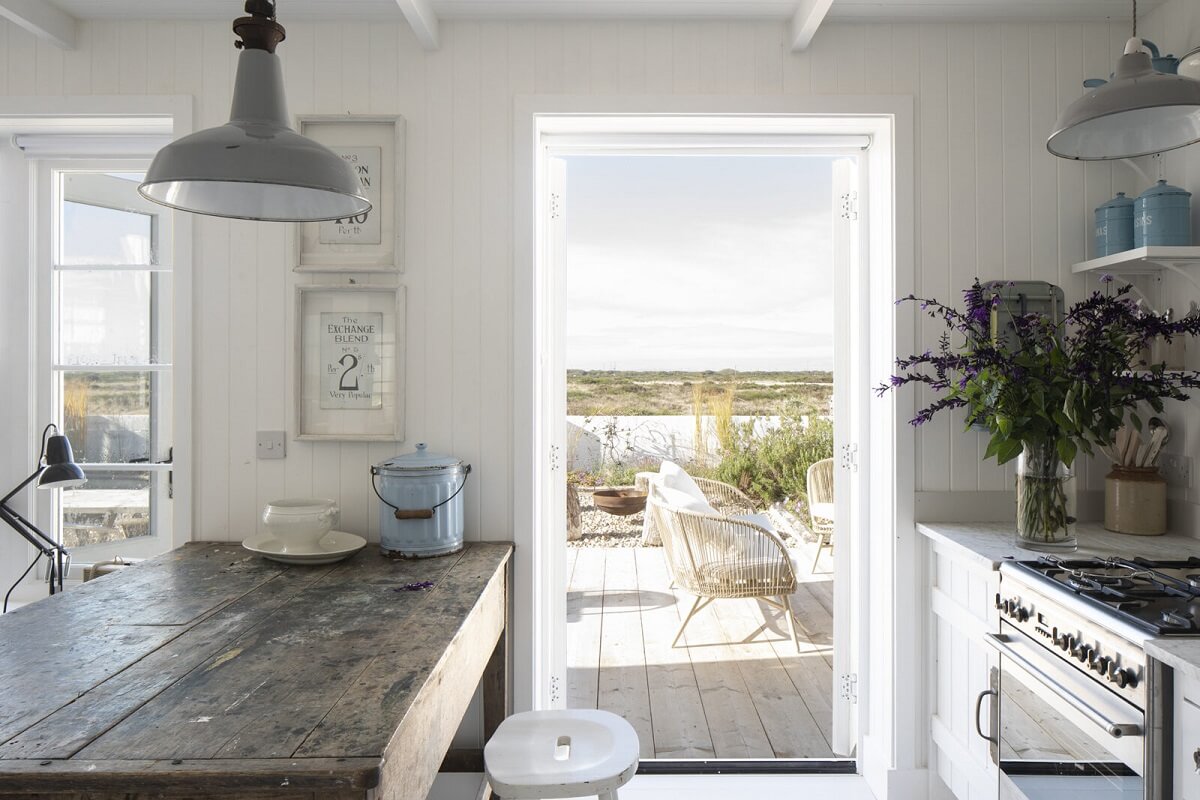 A Bright Coastal Home with Blue Color Accents in England 5 coastal-kitchen-garden-nordroom