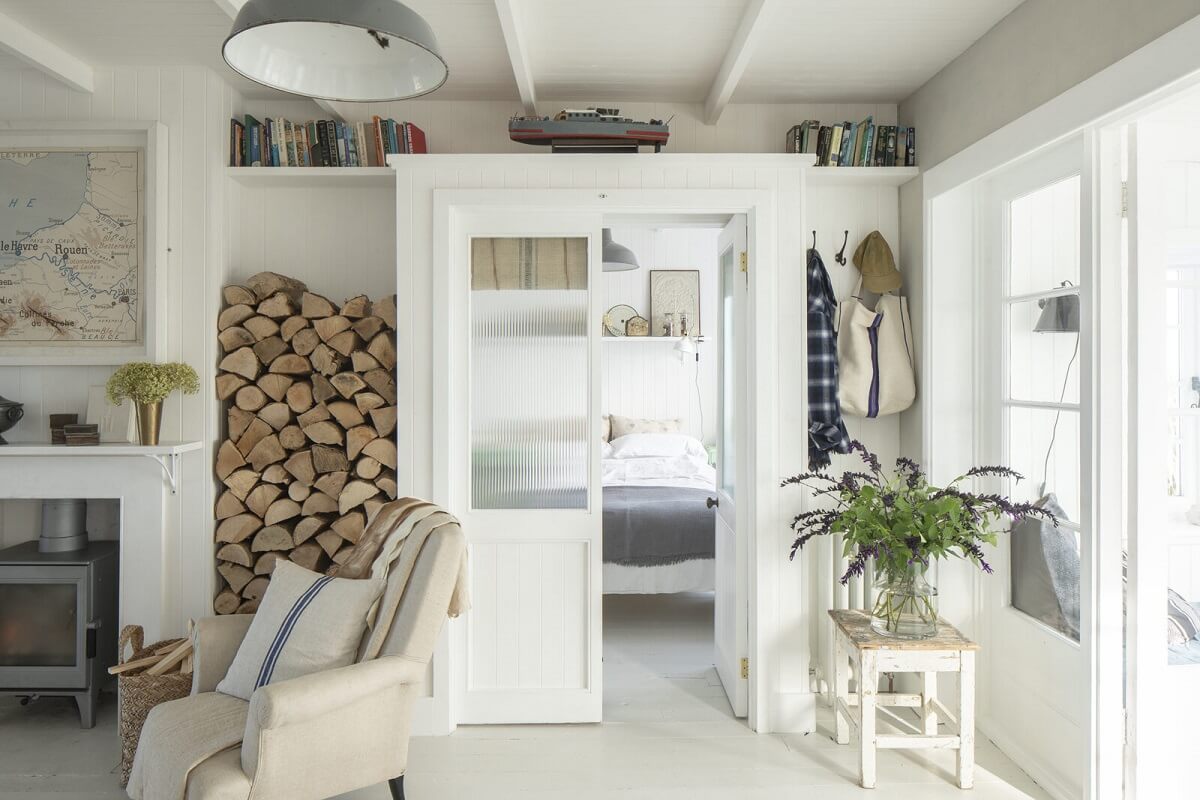 A Bright Coastal Home with Blue Color Accents in England 8 coastal-living-bedroom-doors
