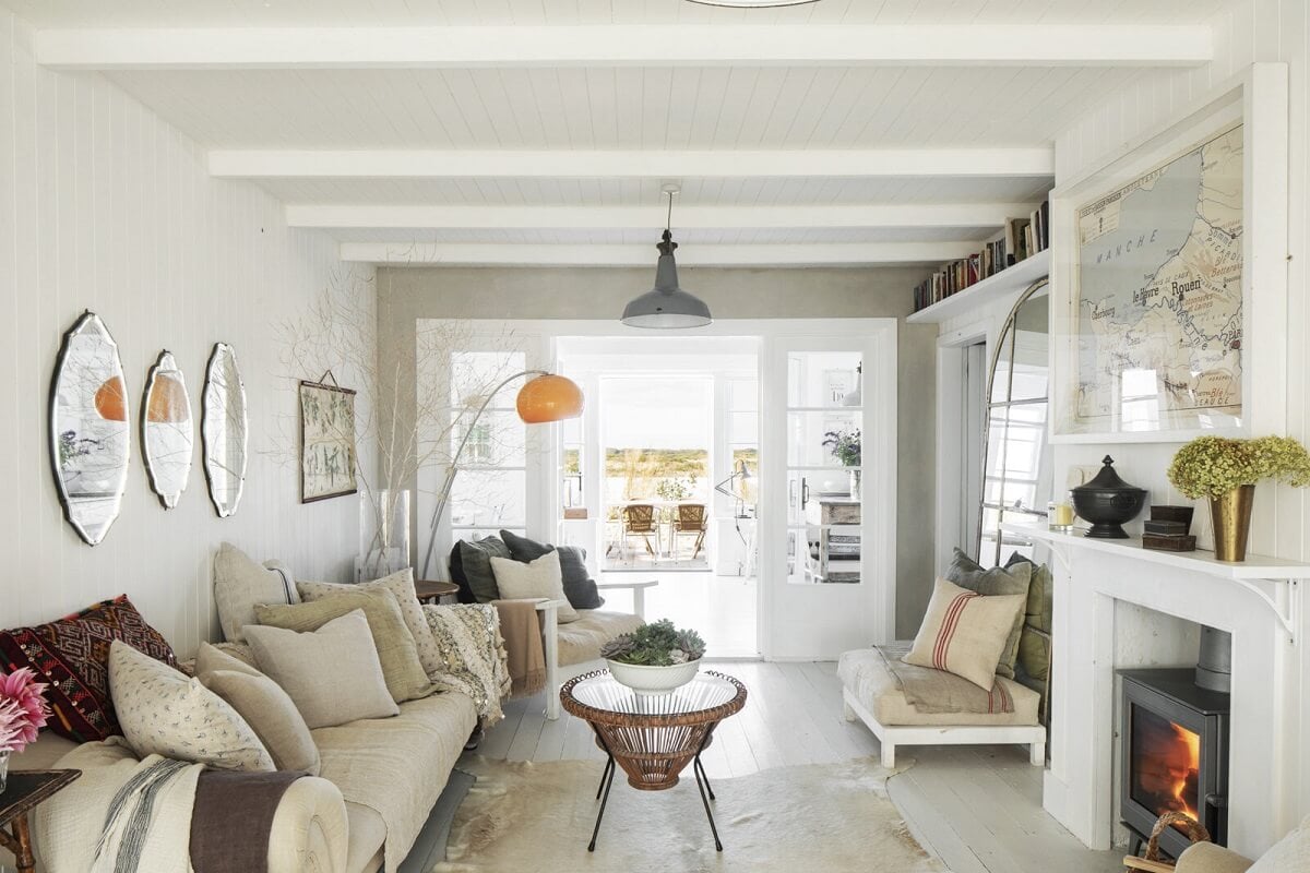 A Bright Coastal Home with Blue Color Accents in England 1 coastal-style-living-room-woodburner-nordroom