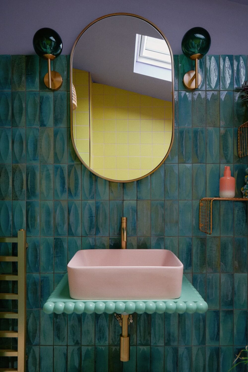 Best of 2023: Bathrooms 7 colorful-bathroom-green-tiles-pink-sink-nordroom