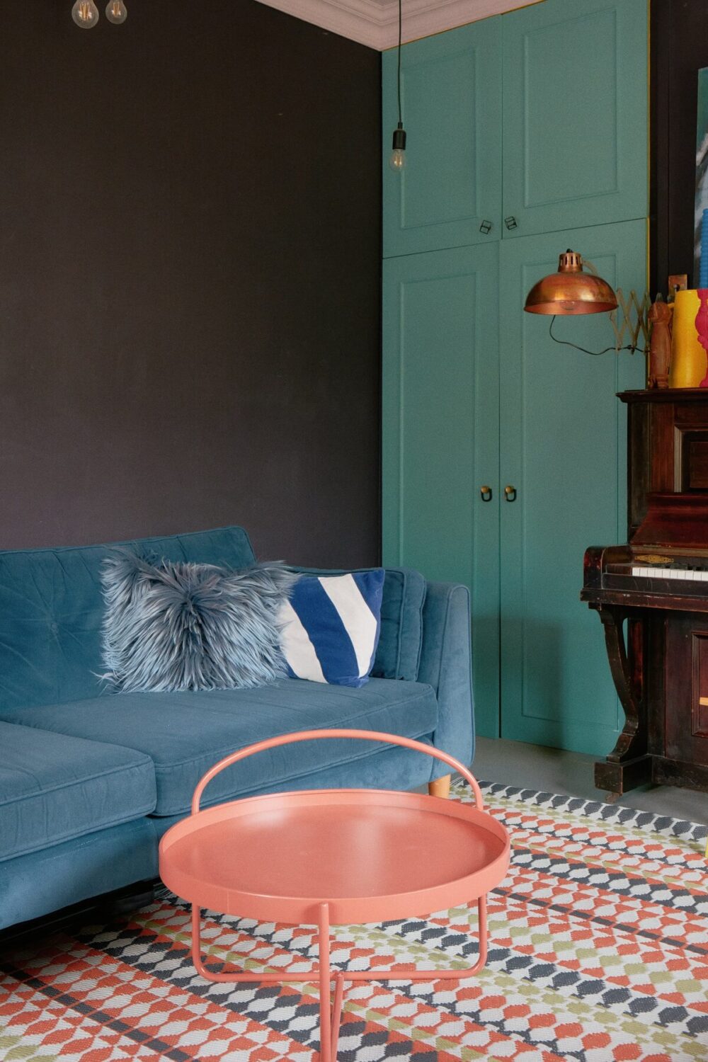 A Fun Colorful Family House in England 10 colorful-living-room-blue-built-in-cabinets-nordroom