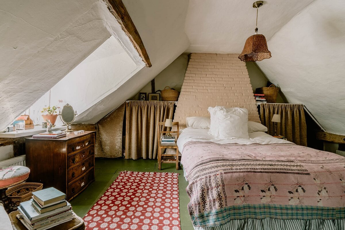 A Colored Sixth Wall May Be The Biggest Paint Trend in 2026 21 cottage-bedroom-slanted-ceiling-green-painted-wooden-floorboards-nordroom