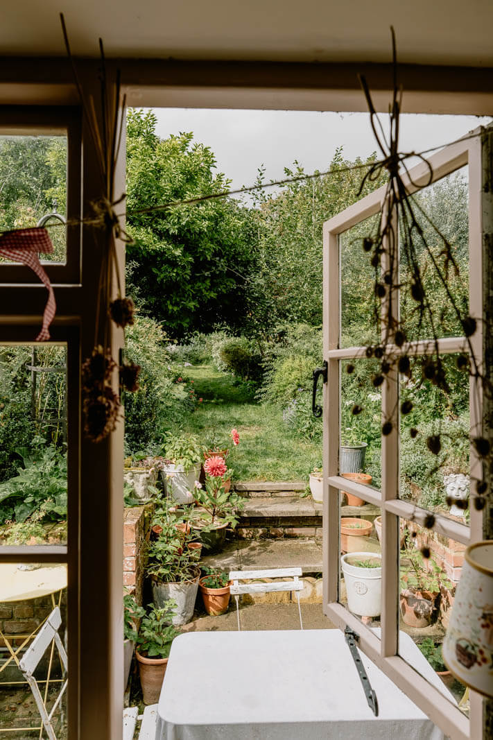 A Charming English Cottage with Color Accents 12 cottage-garden-view-from-kitchen-nordroom